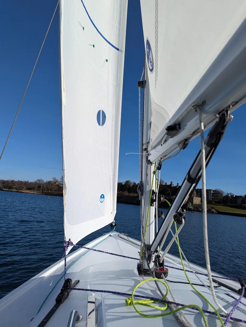 Slide: The Image of 2025 J Boats J 7 sailboat on calm water, clear blue sky. - 5