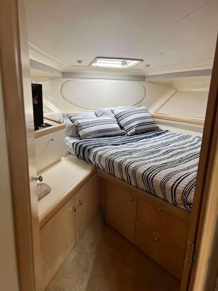 Slide: The Image of Cozy bedroom in 1997 Carver 350 Mariner yacht with striped bedding. - 10