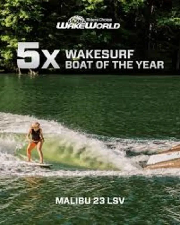 Slide: The Image of 2023 Malibu 23 LSV, award-winning wakesurf boat on a scenic lake. - 11