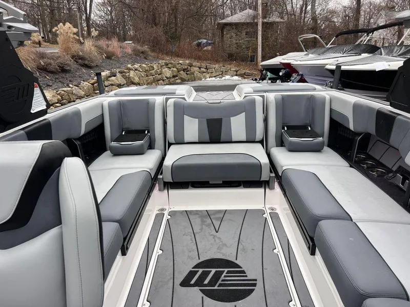 Slide: The Image of 2023 Malibu 23 LSV boat interior with gray seating and stylish design. - 15