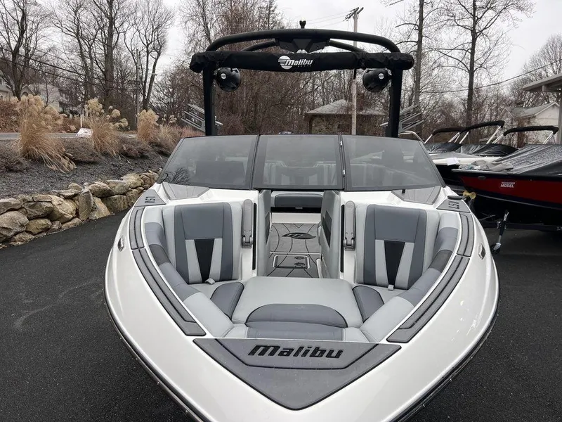 Slide: The Image of 2023 Malibu 23 LSV boat with sleek design and spacious seating. - 20