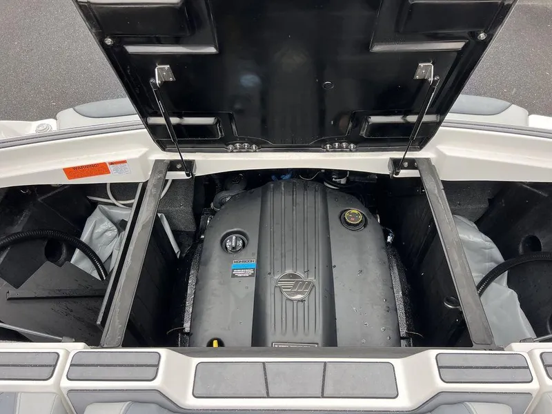 Slide: The Image of 2023 Malibu 23 LSV engine compartment with open hatch. - 25