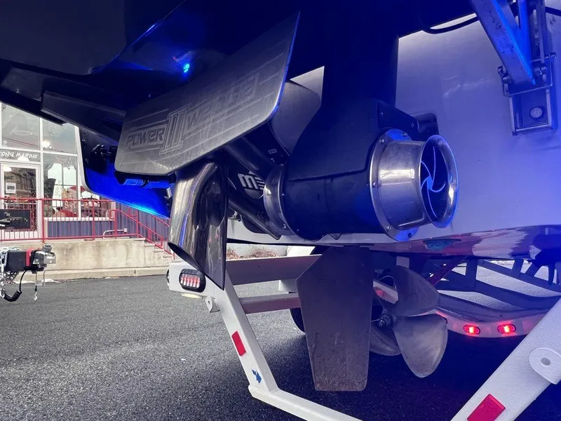 Slide: The Image of Close-up of 2023 Malibu 23 LSV boat propeller and rudder system. - 9