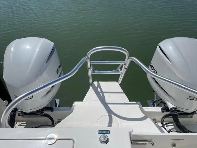 Slide: The Image of 2019 World Cat 320 DC boat with twin Yamaha outboard engines on water. - 22