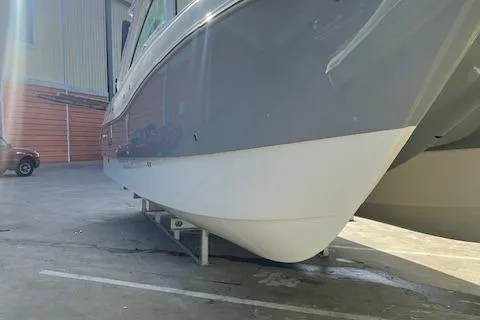 Slide: The Image of 2019 World Cat 320 DC boat in a warehouse, side view. - 4