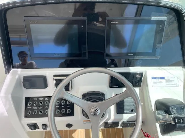 Slide: The Image of 2019 World Cat 320 DC helm with dual displays and control panel. - 8