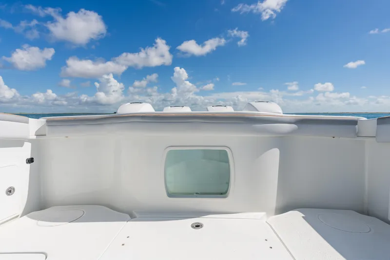 Slide: The Image of 2019 Yellowfin 42 Center Console boat deck under clear blue sky. - 15