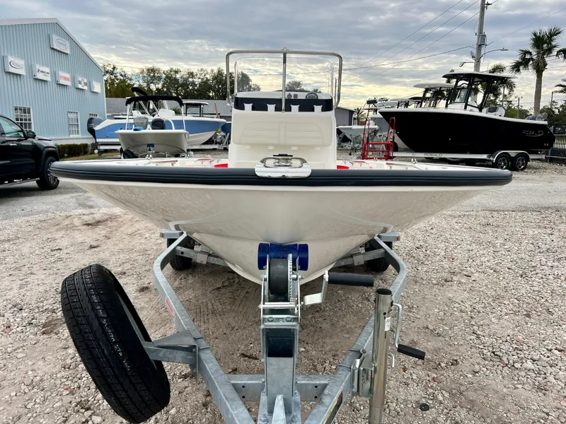 Slide: The Image of 2025 Boston Whaler 150 Montauk boat on trailer at dealership. - 3