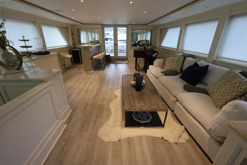 Slide: The Image of Luxurious interior of 1988 Broward 124 Tri-Deck MY yacht with elegant furnishings. - 25