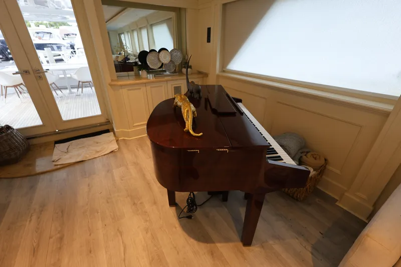 Slide: The Image of Grand piano in luxurious 1988 Broward 124 Tri-Deck yacht interior. - 27