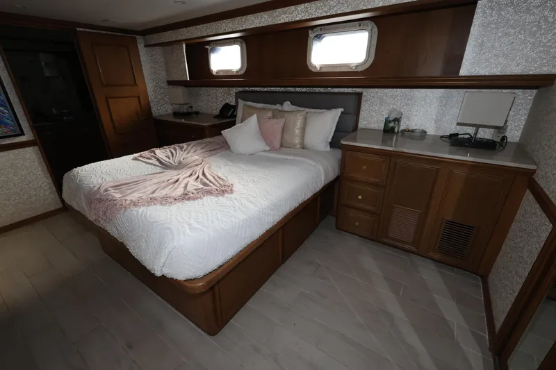 Slide: The Image of Luxurious bedroom interior on 1988 Broward 124 Tri-Deck MY yacht. - 40