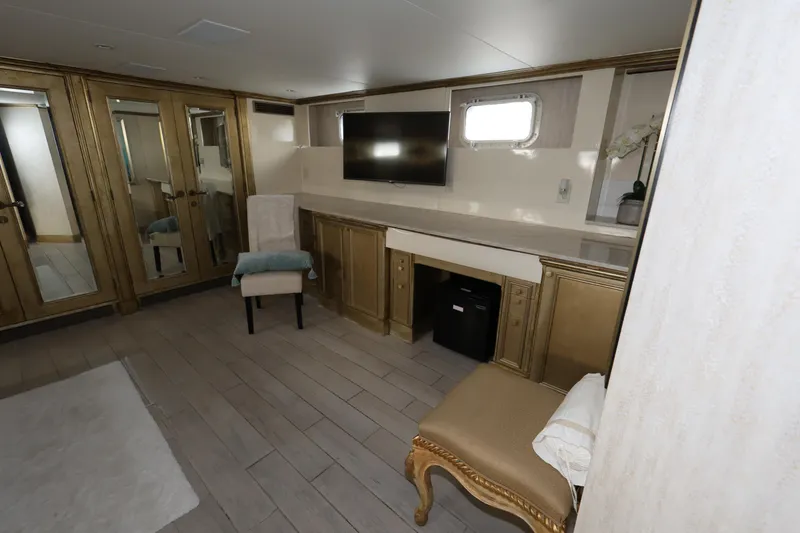 Slide: The Image of Luxurious interior of 1988 Broward 124 Tri-Deck MY yacht with elegant furnishings. - 48
