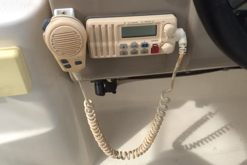 Slide: The Image of Boat radio system on a 2000 Maxum 2800 SCR, featuring a microphone and control panel. - 12