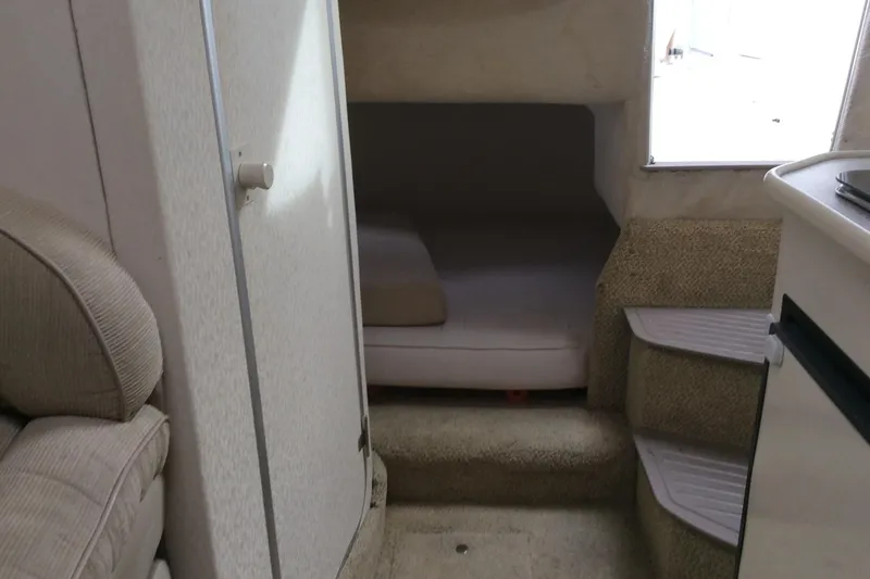 Slide: The Image of Interior of 2000 Maxum 2800 SCR boat with cozy cabin and seating area. - 21