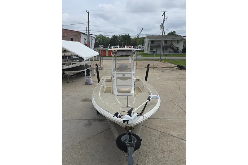 Slide: The Image of 2017 Robalo 206 Cayman boat parked on concrete lot, front view. - 12