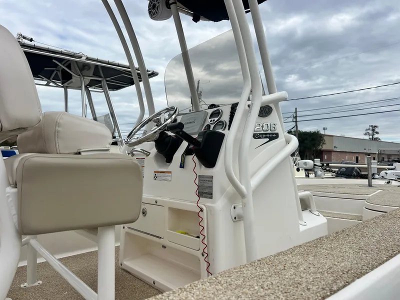 Slide: The Image of 2017 Robalo 206 Cayman boat interior with steering console and seating. - 5