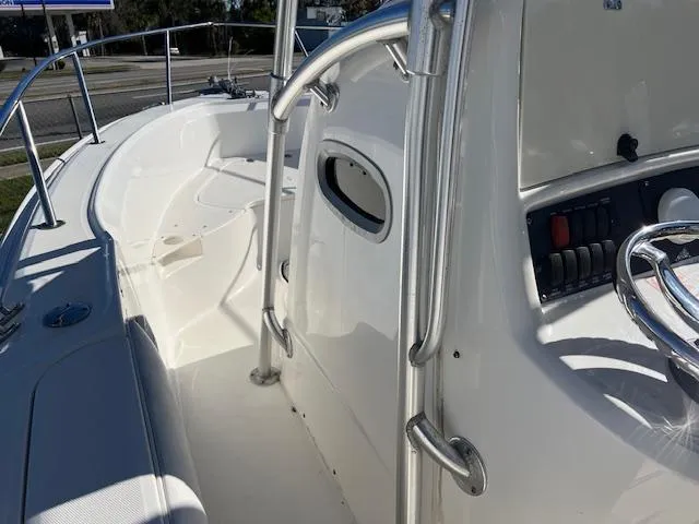 Slide: The Image of 2004 Boston Whaler 240 Outrage boat interior with steering console and seating area. - 7