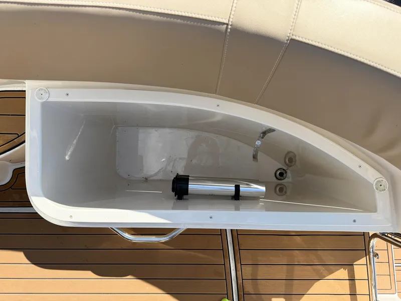 Slide: The Image of Storage compartment on a 2016 Carver C37 Coupe boat with wooden deck. - 21