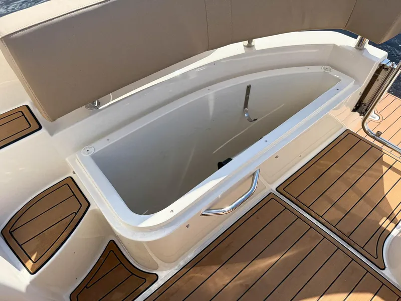 Slide: The Image of 2016 Carver C37 Coupe boat storage compartment with teak flooring. - 22