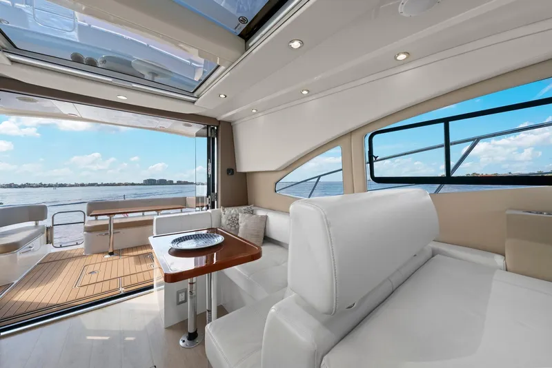 Slide: The Image of Luxurious interior of 2016 Carver C37 Coupe yacht with elegant seating and scenic water view. - 33