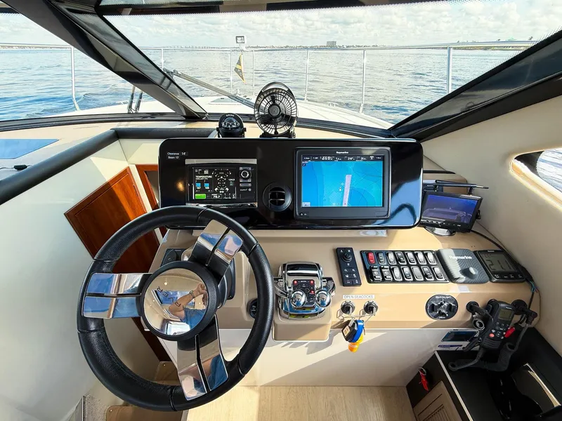 Slide: The Image of Helm of 2016 Carver C37 Coupe yacht with modern navigation equipment. - 40