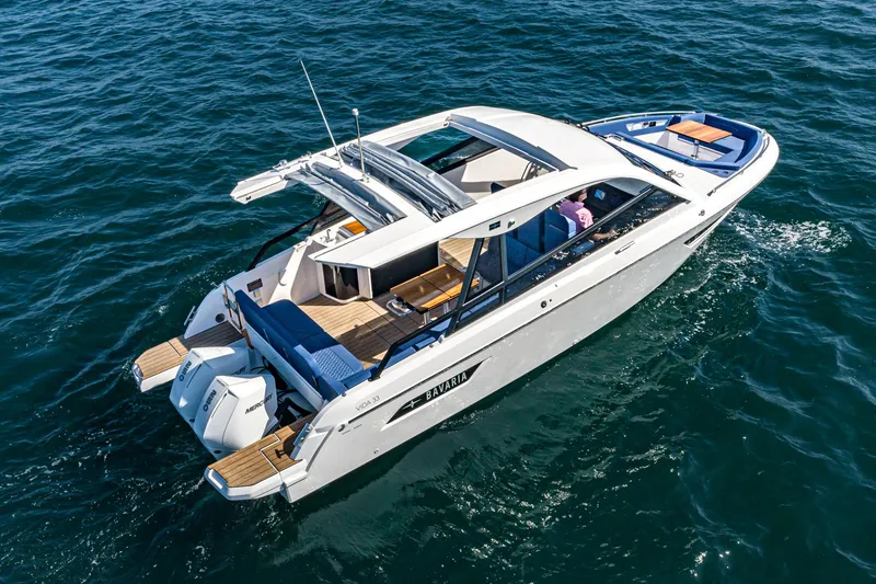 Slide: The Image of 2023 Bavaria Vida 33 yacht cruising on open water. - 22