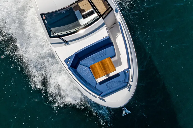 Slide: The Image of Aerial view of 2023 Bavaria Vida 33 yacht cruising on blue water. - 23