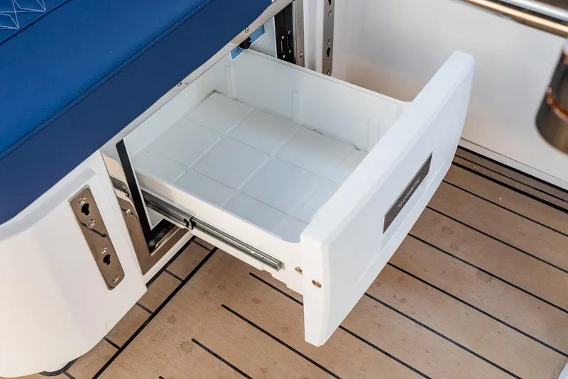 Slide: The Image of Open storage drawer on Bavaria Vida 33 yacht, 2023 model, with wooden flooring. - 38
