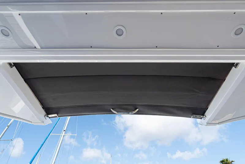 Slide: The Image of Bavaria Vida 33 boat canopy, 2023 model, with blue sky background. - 44