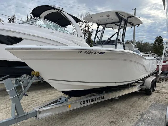 The Image of 2021 Sea Fox 248 Commander boat on a Continental trailer, parked outdoors. - 0