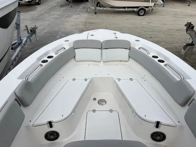 Slide: The Image of 2021 Sea Fox 248 Commander boat interior with cushioned seating and storage compartments. - 11