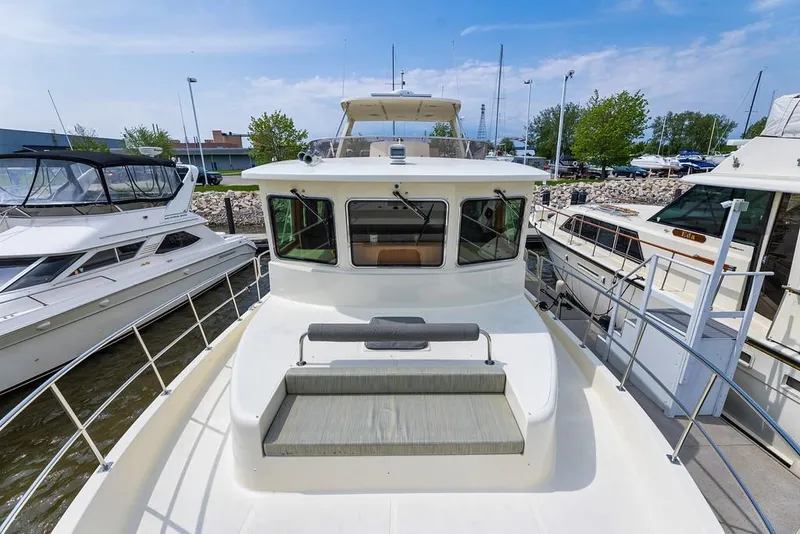 Slide: The Image of 2016 North Pacific 49 Pilothouse yacht docked at marina. - 37