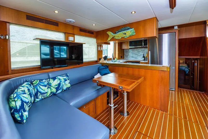 Slide: The Image of Luxurious 2016 North Pacific 49 Pilothouse interior with modern kitchen and cozy seating area. - 4