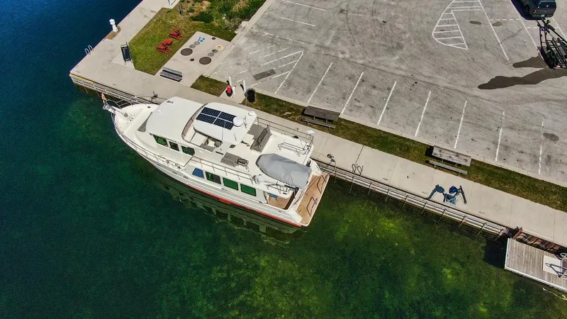 Slide: The Image of Aerial view of 2016 North Pacific 49 Pilothouse docked at a marina. - 40