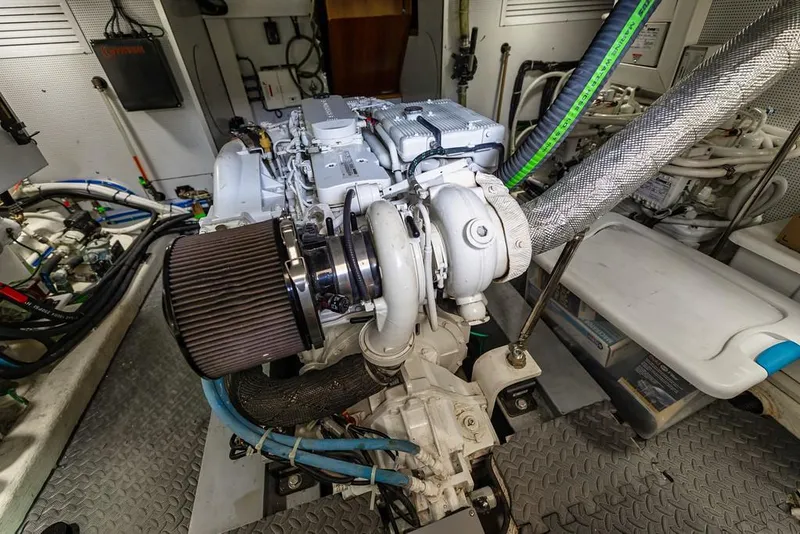 Slide: The Image of Engine room of 2016 North Pacific 49 Pilothouse with visible components and wiring. - 45