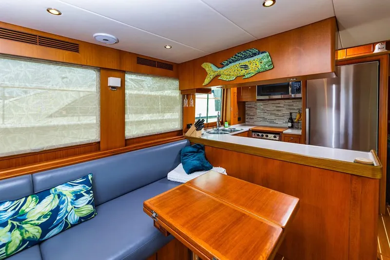 Slide: The Image of Interior of 2016 North Pacific 49 Pilothouse with cozy seating and modern kitchen. - 5