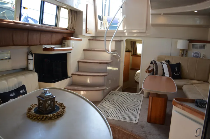 Slide: The Image of Luxurious interior of 1995 Mainship 37 Motor Yacht with elegant seating and nautical decor. - 15