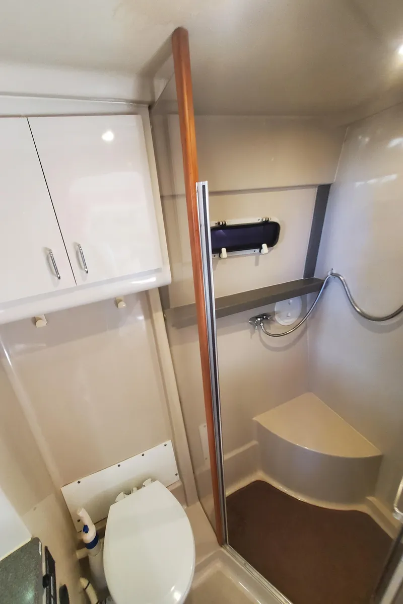 Slide: The Image of Bathroom interior of 1995 Mainship 37 Motor Yacht with shower and toilet. - 20