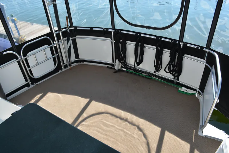 Slide: The Image of Spacious deck of 1995 Mainship 37 Motor Yacht with water view. - 6