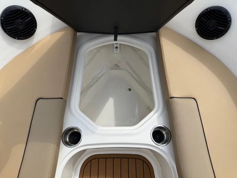 Slide: The Image of 2025 Bayliner VR5 Bowrider OB interior with tan seating and cup holders. - 15