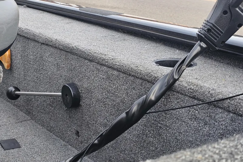 Slide: The Image of 2019 Tracker Panfish 16 boat interior with fishing rod holder. - 9