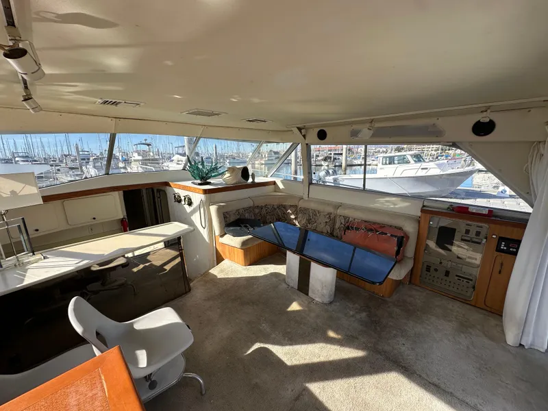 Slide: The Image of Interior of 1990 Trojan 46 Flybridge yacht with seating and control panel. - 20