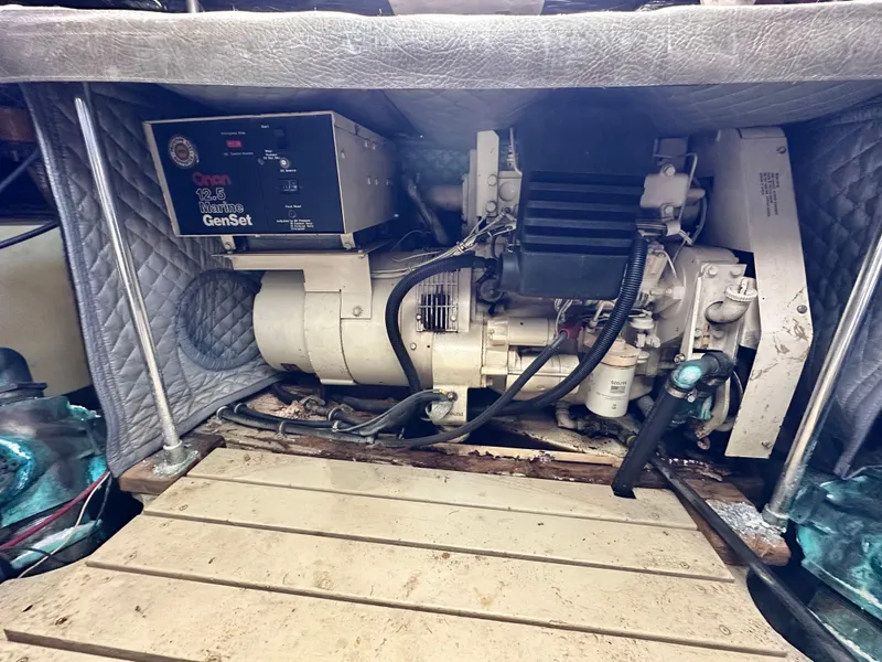 Slide: The Image of Engine compartment of a 1990 Trojan 46 Flybridge boat with a Westerbeke generator. - 24