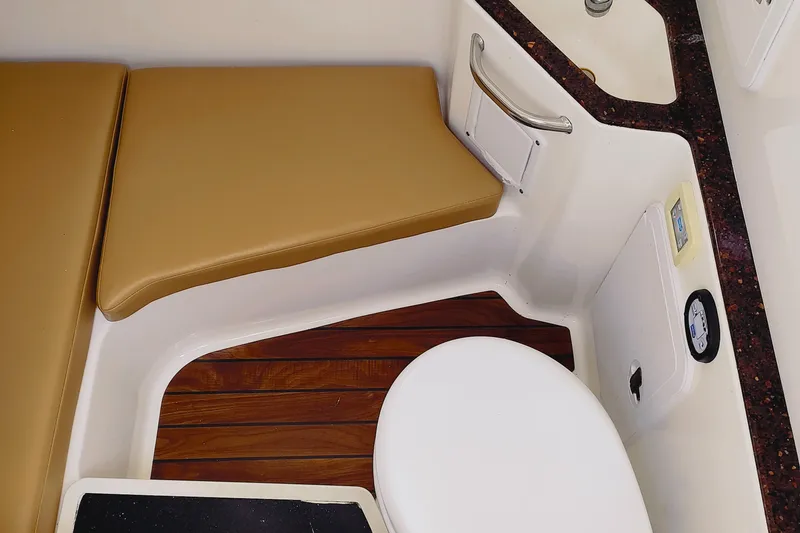 Slide: The Image of Interior of 2014 Edgewater 280CC boat with seating and wooden flooring. - 13