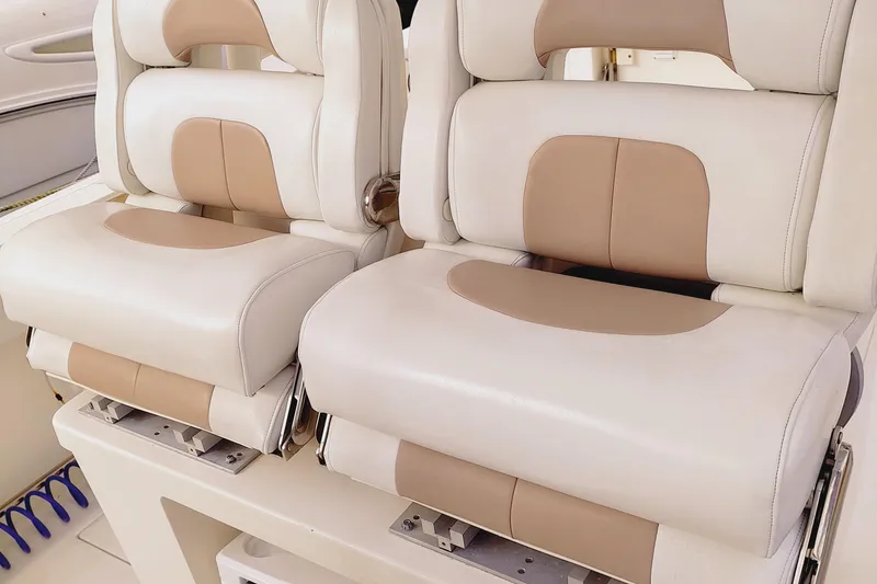 Slide: The Image of 2014 Edgewater 280CC boat seats, beige and white upholstery, comfortable design. - 20