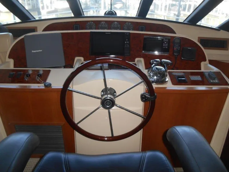 Slide: The Image of 2004 Meridian 540 Pilothouse helm with steering wheel and navigation equipment. - 8