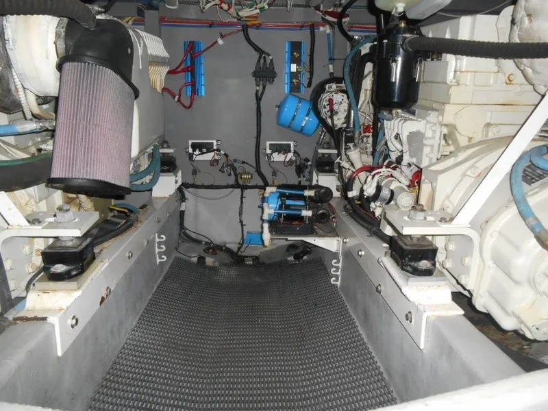 Slide: The Image of Engine room of a 2004 Meridian 540 Pilothouse yacht, showcasing mechanical components and wiring. - 9