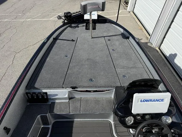 Slide: The Image of 2025 Phoenix 21 XE boat with Lowrance electronics, spacious deck, and modern design. - 10