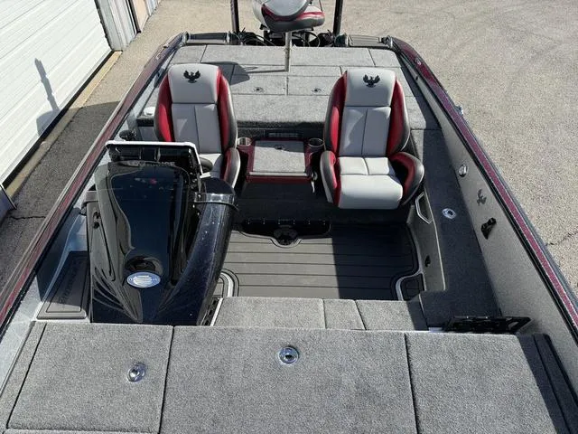 Slide: The Image of 2025 Phoenix 21 XE boat interior with red and gray seating, spacious layout. - 14