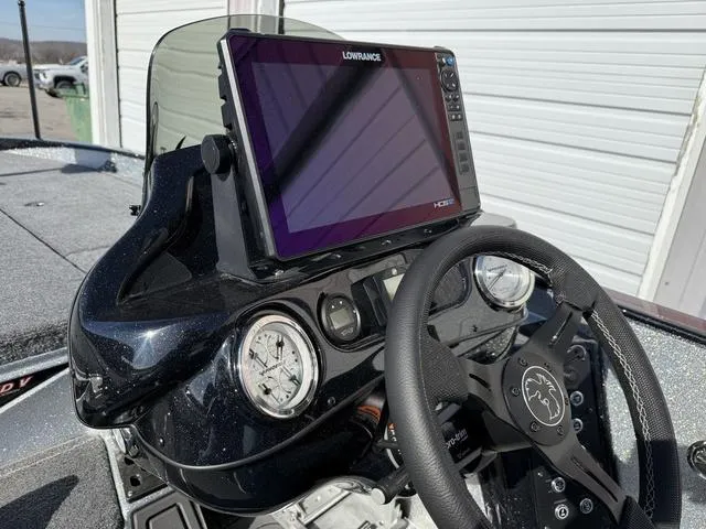 Slide: The Image of Phoenix 21 XE 2025 boat dashboard with Lowrance HDS display and steering wheel. - 16